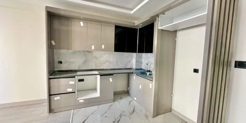 Новая квартира 1+1 у моря в Мерсине, Томюк - Ex240077